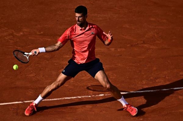 Novak Djokovic plays a forehand return to Spain's Carlos Alcaraz Garfia