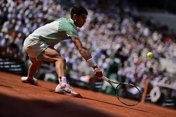 pain's Carlos Alcaraz Garfia plays a forehand return to Serbia's Novak Djokovic during their men's singles semi-final match