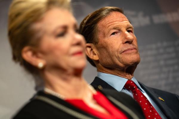 Senators Richard Blumenthal and Marsha Blackburn standing together