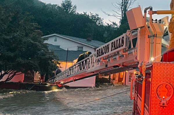 Beacon Falls firefighters helping people evacuate from the Brookside Inn.