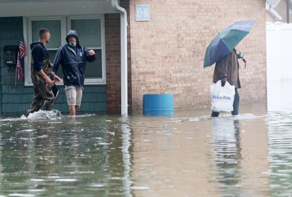 Residents evacuating their homes in Danbury during the storm on Aug. 18, 2024.