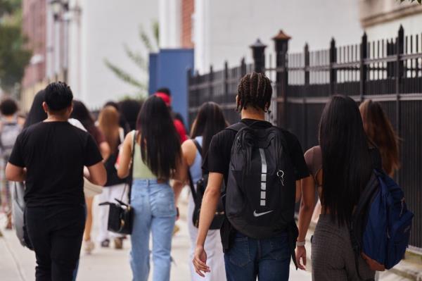 Students walking into Gotham Tech/Newcomers HS in Long Island City on first day.