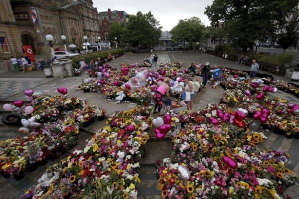 Tributes outside the Town Hall in Southport before a vigil to remember the victims of the stabbing attack.