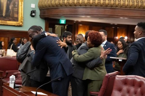 Council members celebrating after the co<em></em>ntroversial bill was passed.