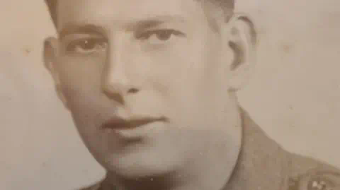 BBC A black and white portrait photograph of Pte Henry Moon