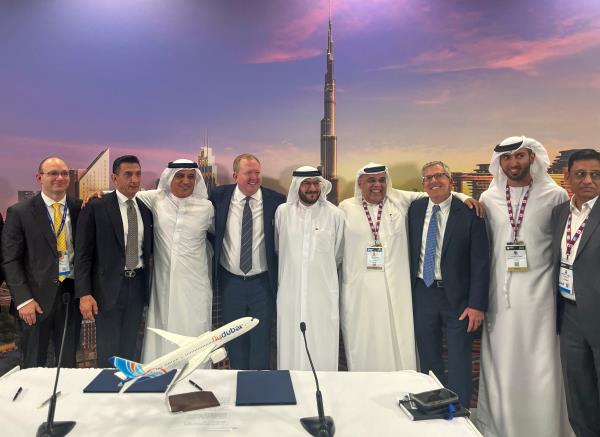 Boeing Commercial Airplanes CEO Stanley Deal poses with Emirates airline COO Adel Al Redha and flyDubai CEO Ghaith Al Ghaith, in Dubai